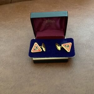 Brand new. Gold style cufflinks featuring unique roadside “men at work“ sign.